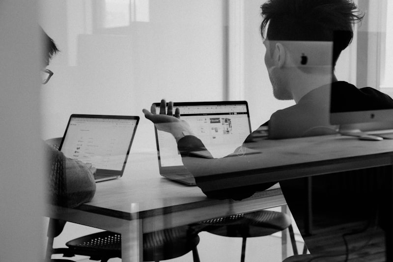 Person working at a laptop in a professional setting